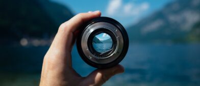 Camera lens looking at a lake